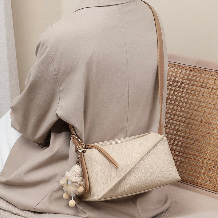 Elegant Geometric Genuine Leather Crossbody Bag with Plush Charm